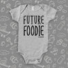 Unique baby onesie with saying "Future Foodie" in grey.