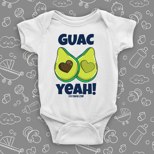 White unique baby onesie with "Guac Yeah!" print and image of avocade with heart-shaped stone.