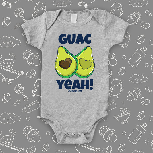 Grey unique baby onesie with "Guac Yeah!" print and image of avocade with heart-shaped stone.