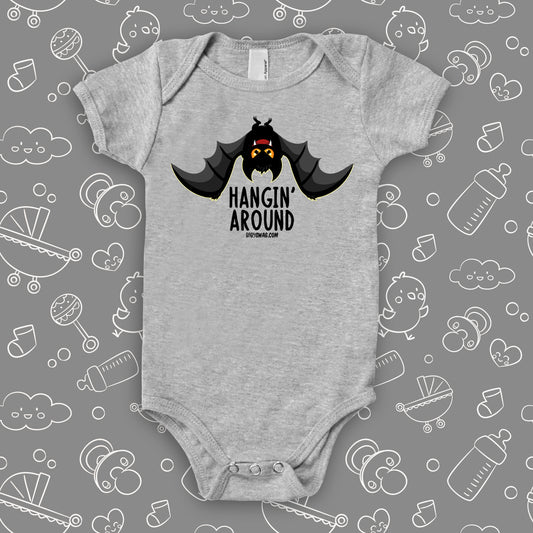 Grey cute baby onesies saying "Hangin' Around" with an image of a bat.