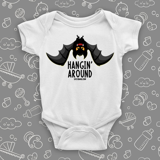 White cute baby onesies saying "Hangin' Around" with an image of a bat.