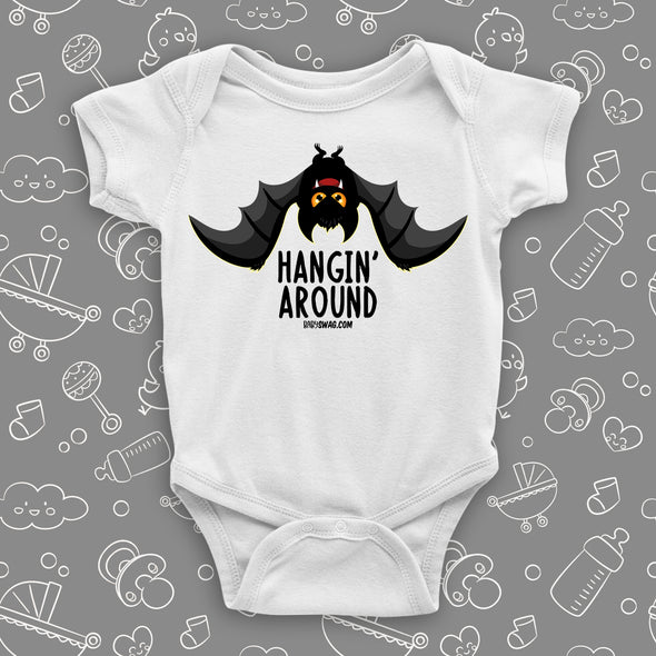 White cute baby onesies saying "Hangin' Around" with an image of a bat. 