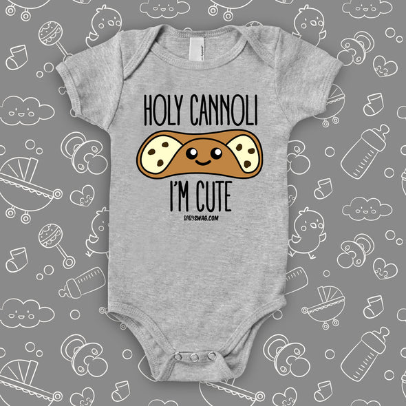 Grey cute baby onesie saying "Holi cannoli, I'm cute".