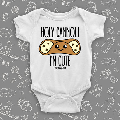 White cute baby onesie saying "Holi cannoli, I'm cute".