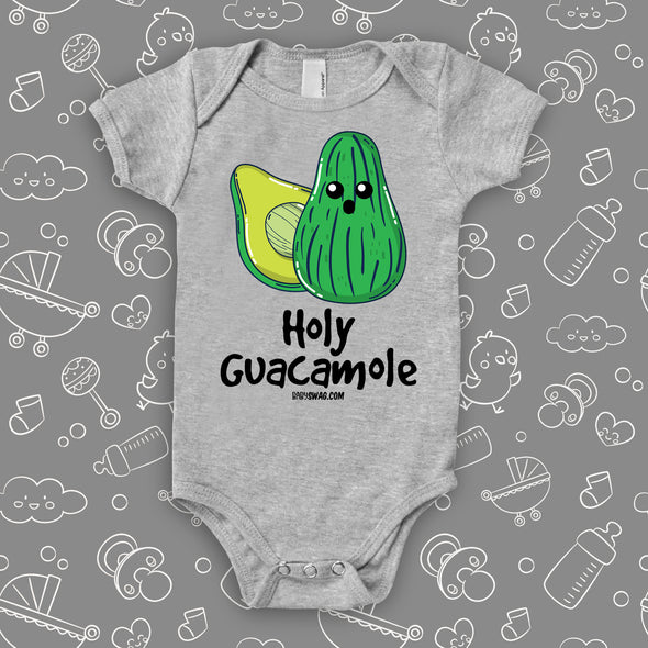 Grey hiarious baby onesie saying "Holy Guacamole" and an avocado image.