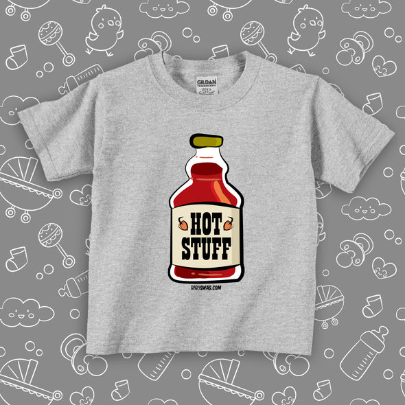 A grey toddler graphic tee with an image of a bottle of "Hot Stuff".