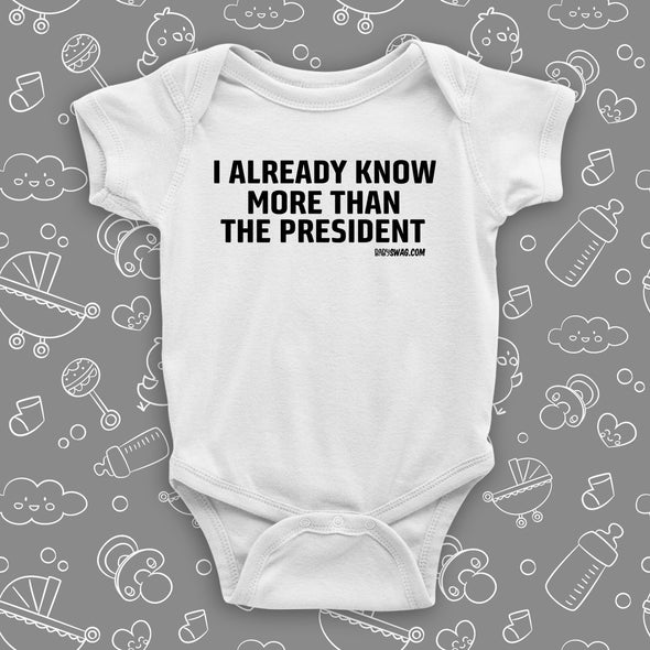 The ''I Already Know More Than The President' hilarious baby onesies in white.