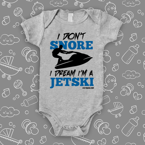 The ''I Don't Snore, I Dream I'm A Jetski'' funny baby onesies in grey.