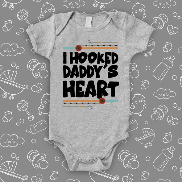 Unique baby onesies with saying "I Hooked Daddy's Heart" in grey.