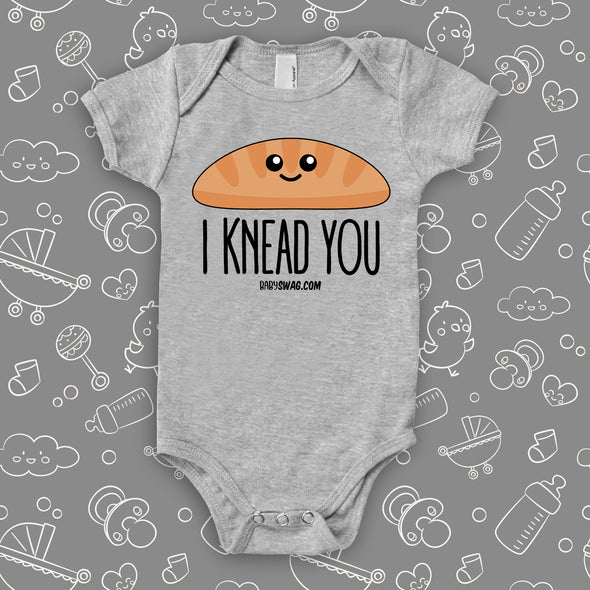 Funny infant onesie saying "I knead you", color grey.
