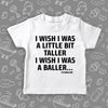 Cool toddler shirt with saying "I Wish I Was A Little Bit Taller" in white.