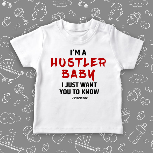  Toddler girl shirts with saying "I'm A Hustler Baby" in white. 