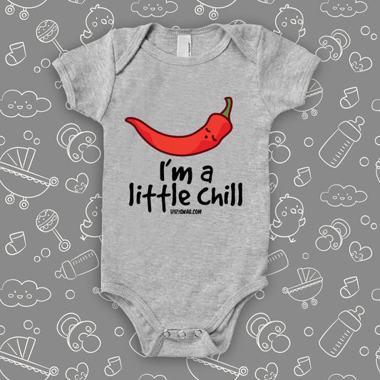 Grey cool baby onesie saying "I'm a little chill" and an image of a red chilly pepper.