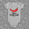 Grey cool baby onesie saying "I'm a little chill" and an image of a red chilly pepper.