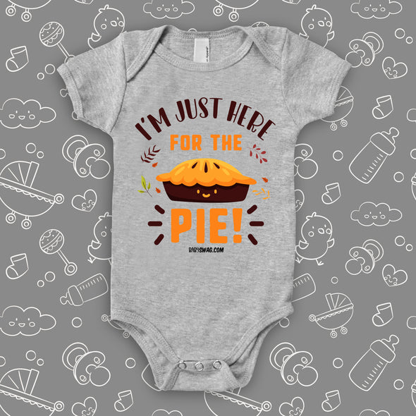 Cute baby onesies with saying "I'm Just Here For The Pie" in grey.