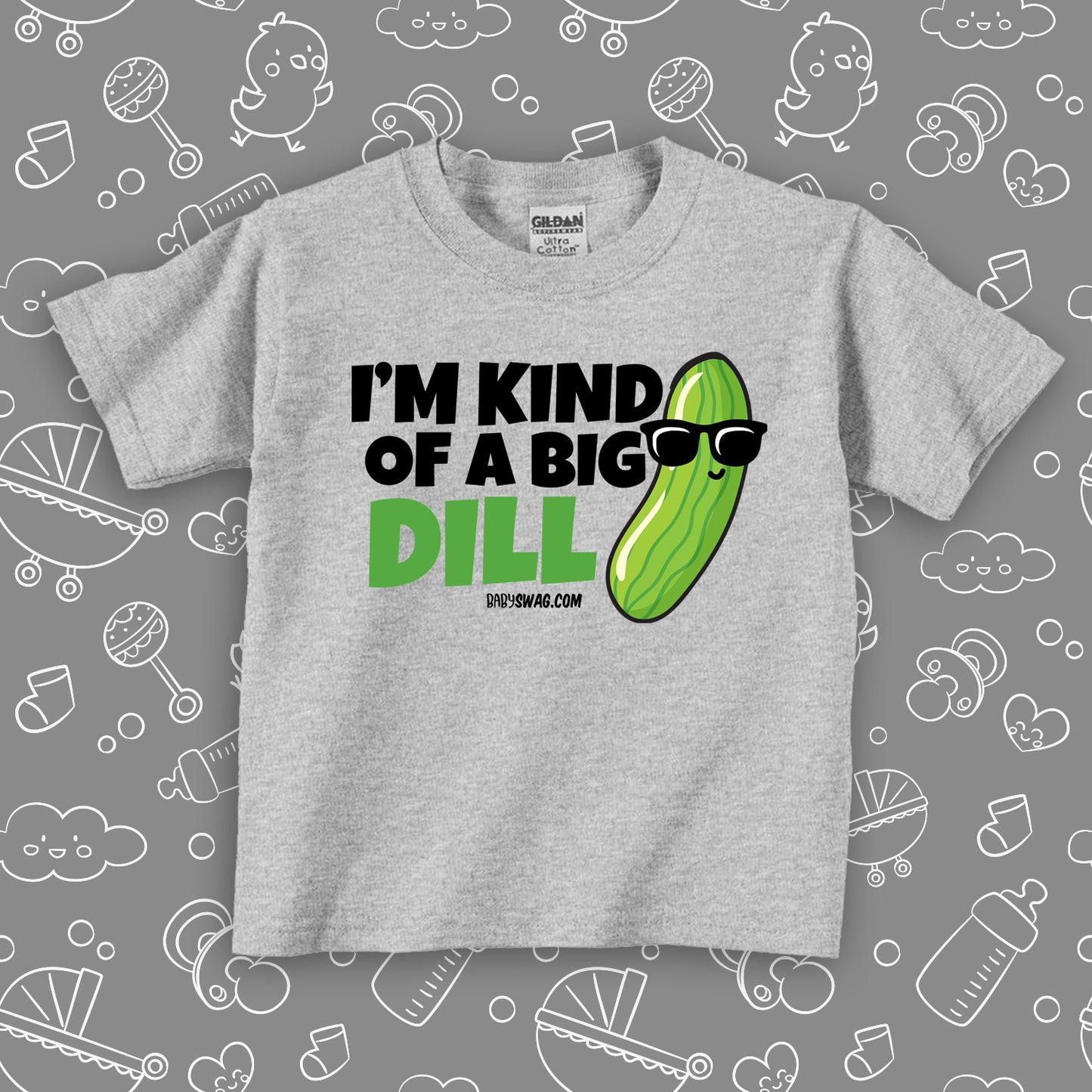 A funny toddler shirt saying "I'm Kind Of A Big Dill", with the image of a pickle wearing sunglasses, in grey. 