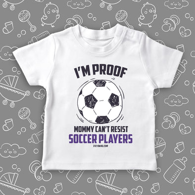 Funny toddler shirt with saying "I'm Proof Mommy Can't Resist Soccer Players" in white.