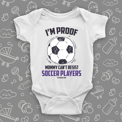 Funny baby onesies with saying "I'm Proof Mommy Can't Resist Soccer Players" in white.