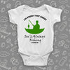 Hilarious baby onesies with a saying "I'm Proof That Daddy Isn't Always Fishing" in white and the drawing of a man in a fishing boat included.