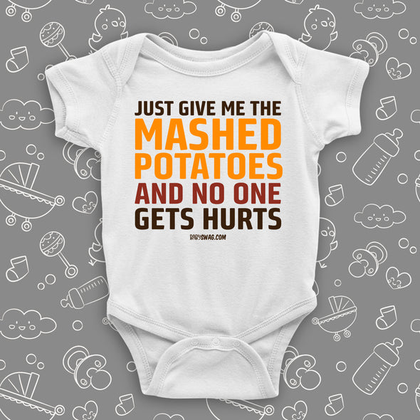 Hilarious baby onesies with saying "Just Give Me The Mashed Potato And No One Gets Hurts"  in white.