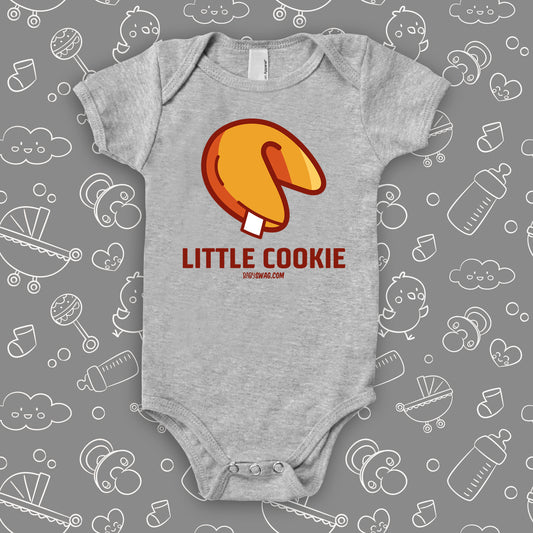 A grey cute baby onesie with "Little Cookie" print and an image of a fortune cookie.