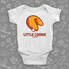 A white cute baby onesie with "Little Cookie" print and an image of a fortune cookie.