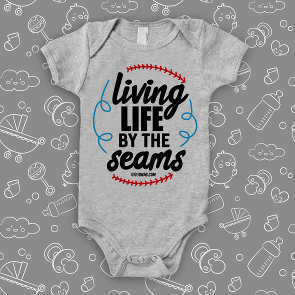 Cool baby onesies with saying "Living Life By The Seams" in grey. 