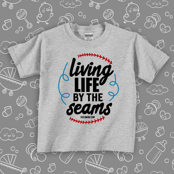  Toddler boy graphic tees with saying "Living Life By The Seams" in grey. 