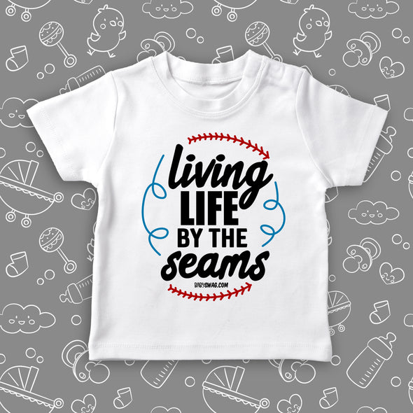 Toddler boy graphic tees with saying "Living Life By The Seams" in white.