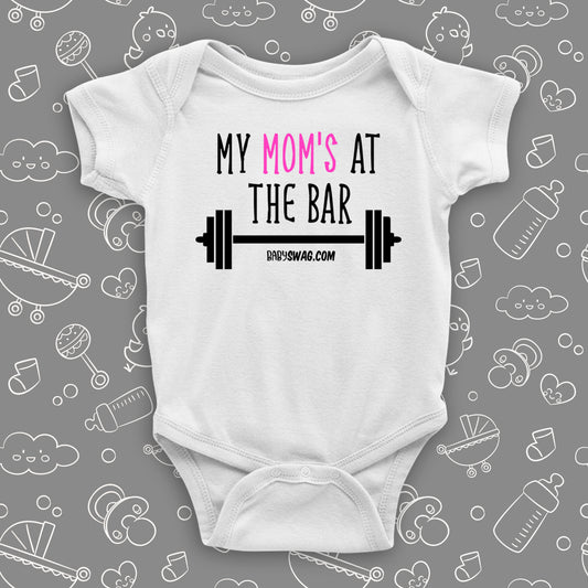 Cool baby onesies with saying: "Mom's At The Bar" in white.