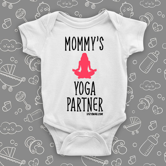 Cute baby onesies with saying "Mommy's Yoga Partner" in white.