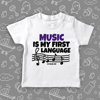White toddler graphic tee with saying "Music Is My First Language" 