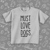 Toddler shirts with sayings "Must Love Dogs" in grey. 