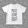 Toddler shirts with sayings "Must Love Dogs!" in white.