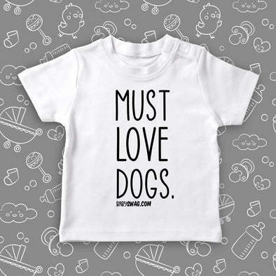 Toddler shirts with sayings "Must Love Dogs!" in white.