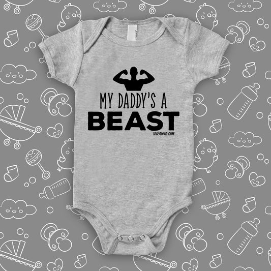 The ''My Daddy's A Beast'' cool baby onesie in grey.