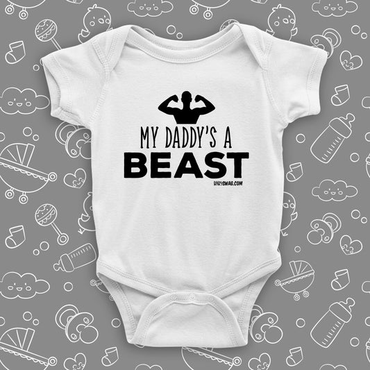 The ''My Daddy's A Beast'' cool baby onesie in white. 