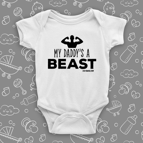 The ''My Daddy's A Beast'' cool baby onesie in white. 