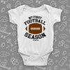 The "My First Football Season" cute baby boy onesies in white. 