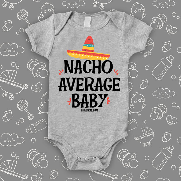 Cool baby onesie saying "Nacho Average Baby" with an image of a hat, color grey.