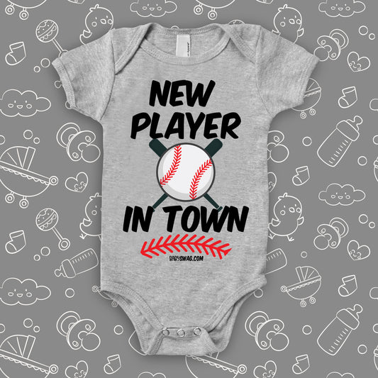 Unique baby onesie with saying "New Player In Town" in grey.