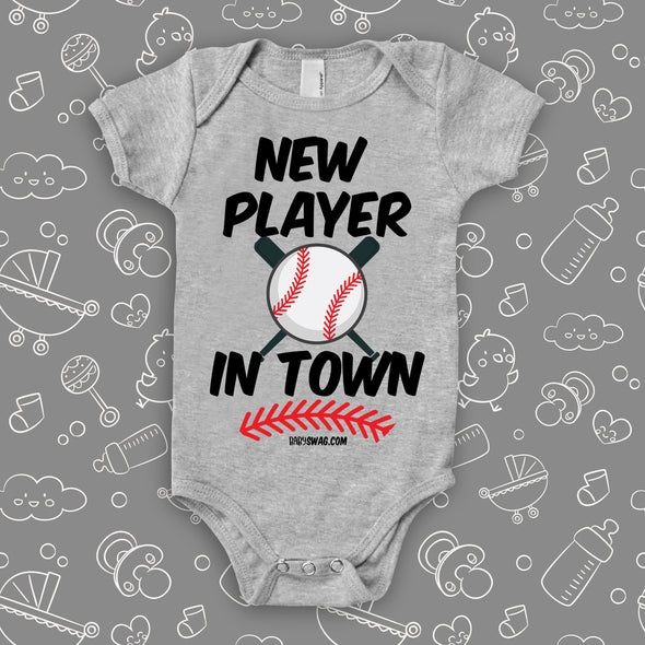 Unique baby onesie with saying "New Player In Town" in grey. 