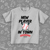 Cute toddler shirt with saying "New Player In Town" in grey.
