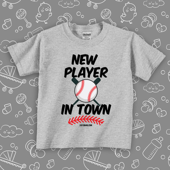 Cute toddler shirt with saying "New Player In Town" in grey.