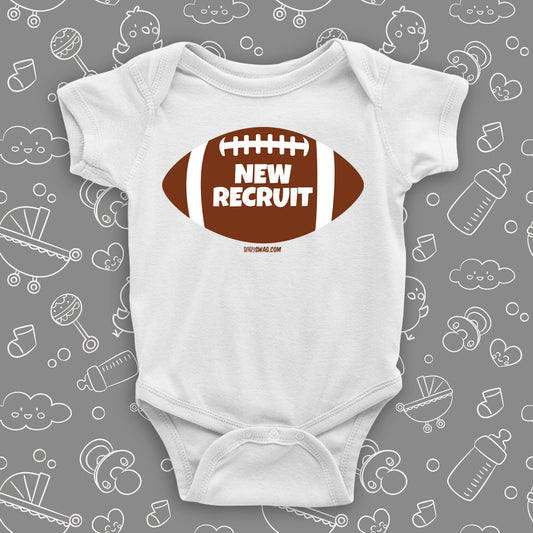Funny baby boy onesie with a picture of a football and "New Recruit" print, color white.
