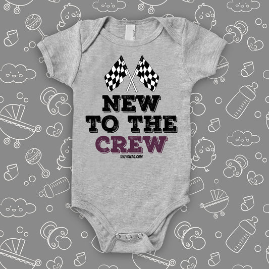 A grey baby boy onesie with "New To The Crew" print.
