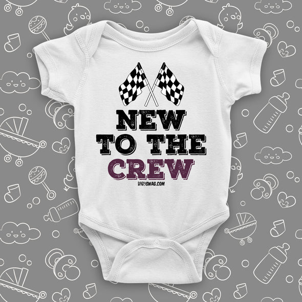 A white baby boy onesie with "New To The Crew" print. 