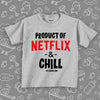 Toddler shirt with saying "Product Of Netflic & Chill" in grey. 