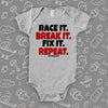 Unique baby boy onesie saying "Race It. Break It. Fix It. Repeat.", in grey. 