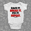 Unique baby boy onesie saying "Race It. Break It. Fix It. Repeat.", in white.
